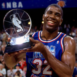 ORLANDO- FEBRUARY 9: Magic Johnson #32 of the Western Conference All-Stars holds the MVP trophy following the 1992 NBA All Star Game on February 9, 1992 at the Orlando Arena in Orlando, Florida. NOTE TO USER: User expressly acknowledges that, by downloading and or using this photograph, User is consenting to the terms and conditions of the Getty Images License agreement. Mandatory Copyright Notice: Copyright 1987 NBAE (Photo by Andrew D. Bernstein/NBAE via Getty Images)